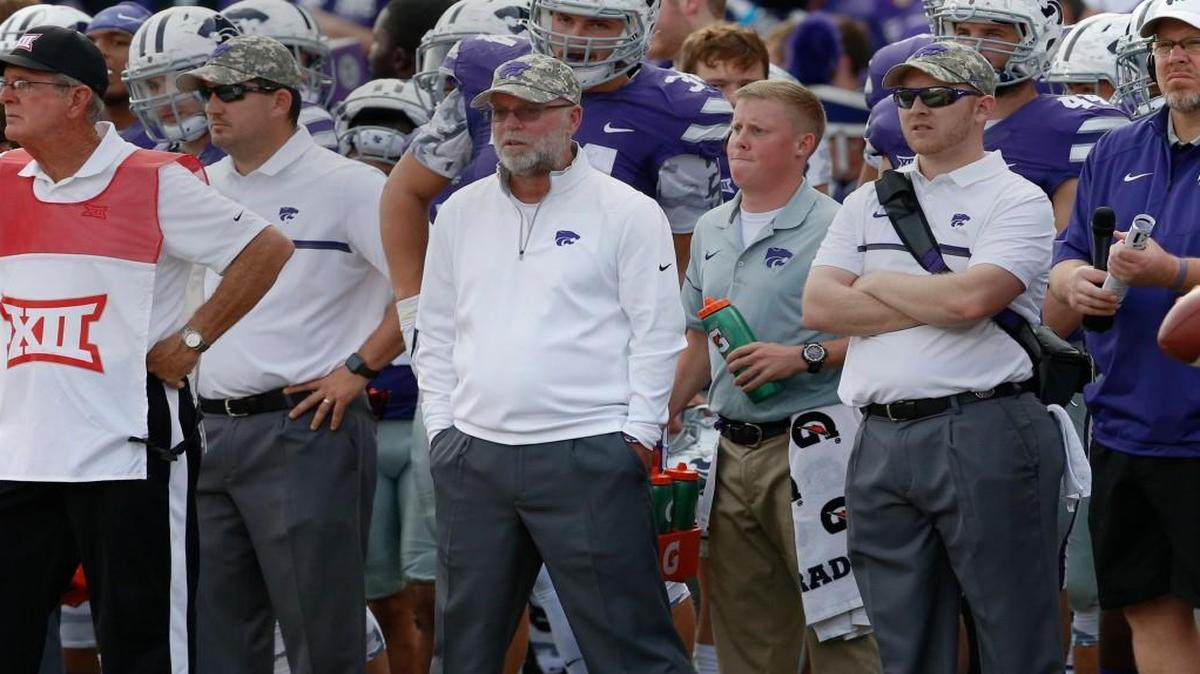 Jerry Kill, center, watches K-State take on Oklahoma State last week. “I may have started a trend,” Kill said. “As much as I enjoy this job, you might see athletic directors start hiring more retired coaches for this type of position. It’s a perfect fit.”