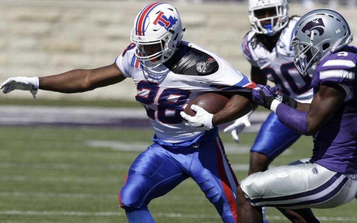 
Louisiana Tech running back Kenneth Dixon was tackled by Kansas State defensive back Johnathan Durham during Saturday’s game.
