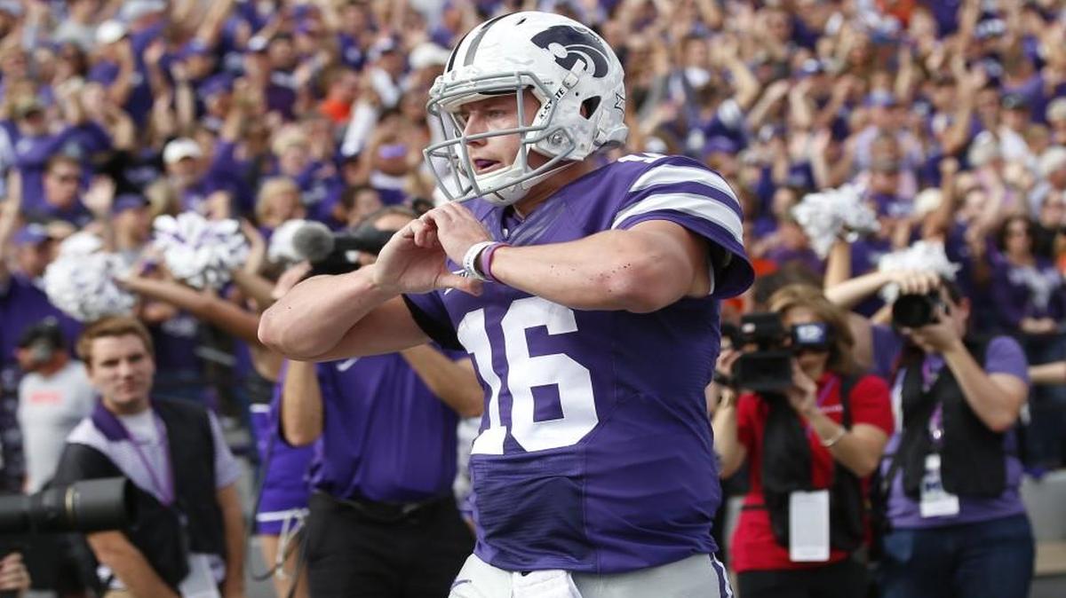 K-State quarterback Jesse Ertz celebrated touchdowns Saturday by forming a heart with his hands, an apparent nod to his older sister, Lydia Gatton, who is being treated for a brain tumor on her frontal lobe. (November 6, 2016)