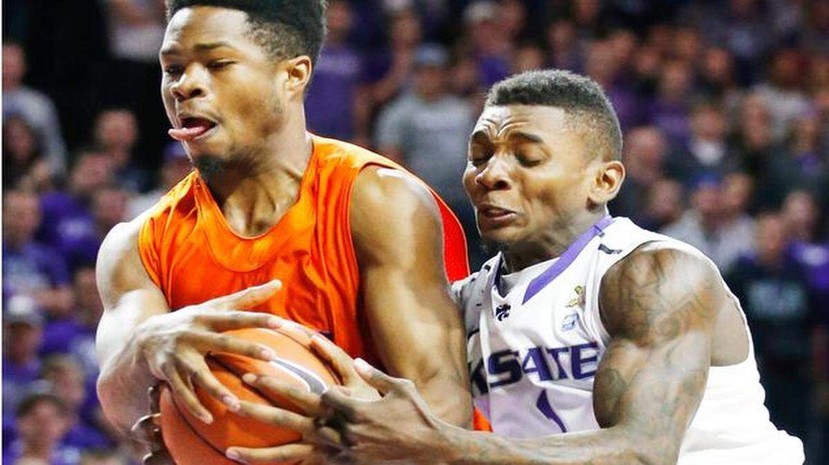 
Kansas State guard Jevon Thomas (1) tried to strip a rebound from Savannah State forward Saadiq Muhammad in the Wildcats’ 73-53 on Sunday at Bramlage Coliseum in Manhattan, Kan.
