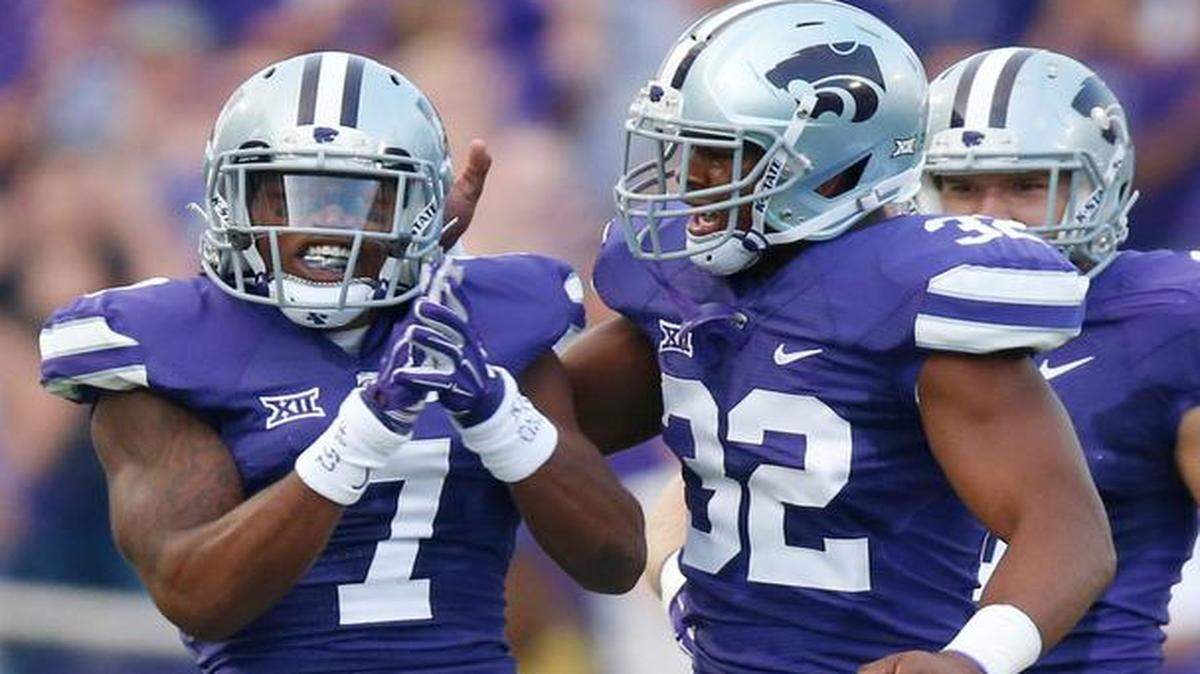 
K-State linebacker Dakorey Johnson (right) and defensive back Danzel McDaniel celebrated after a successful stop against Auburn.
