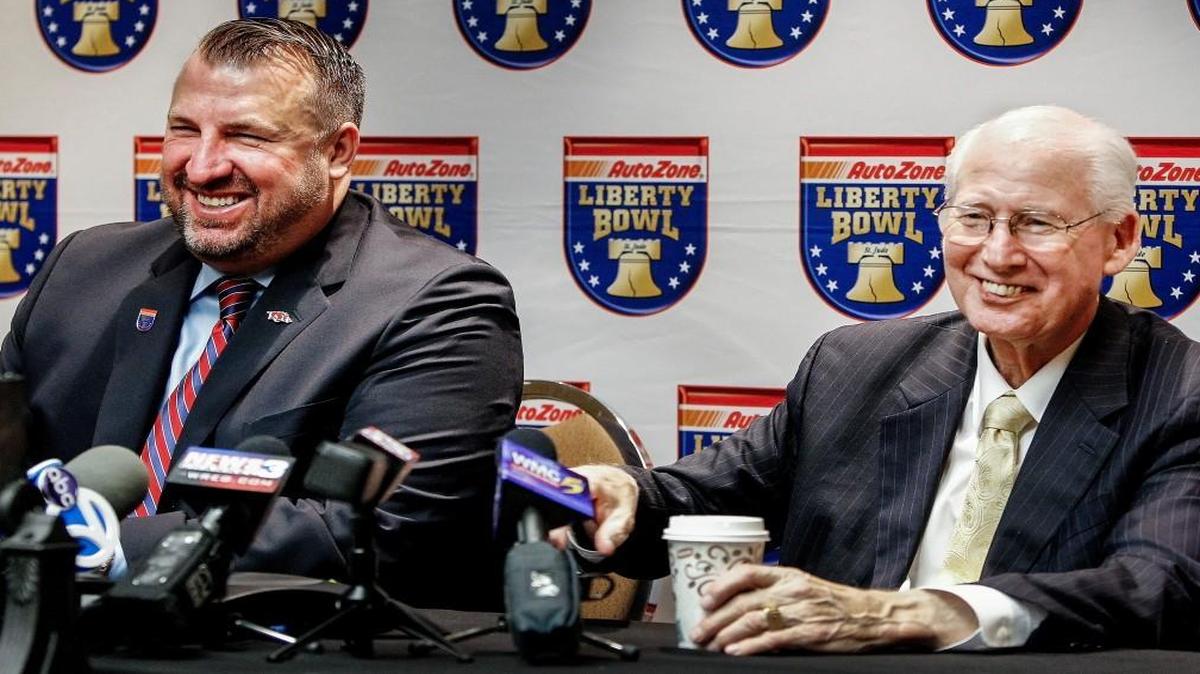 FILE - In this Dec. 10, 2015, file photo, Arkansas coach Bret Bielema, right, and Kansas State coach Bill Snyder discuss the Libery Bowl. (Mark Weber/The Commercial Appeal via AP, File) MANDATORY CREDIT