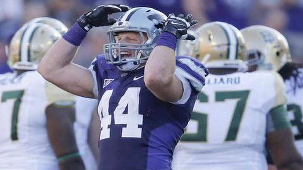 
Kansas State senior defensive end Ryan Mueller (center) won’t settle for a 9-4 season. He calls that “just average.”
