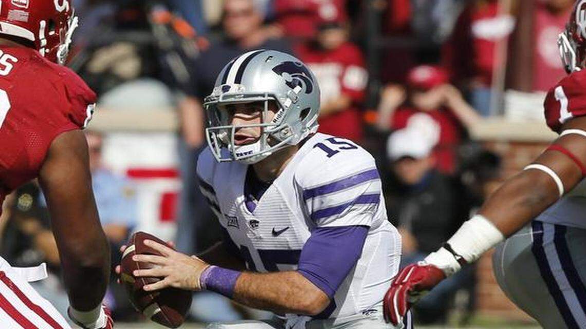 
Kansas State quarterback Jake Waters looked for running room against the Sooners.
