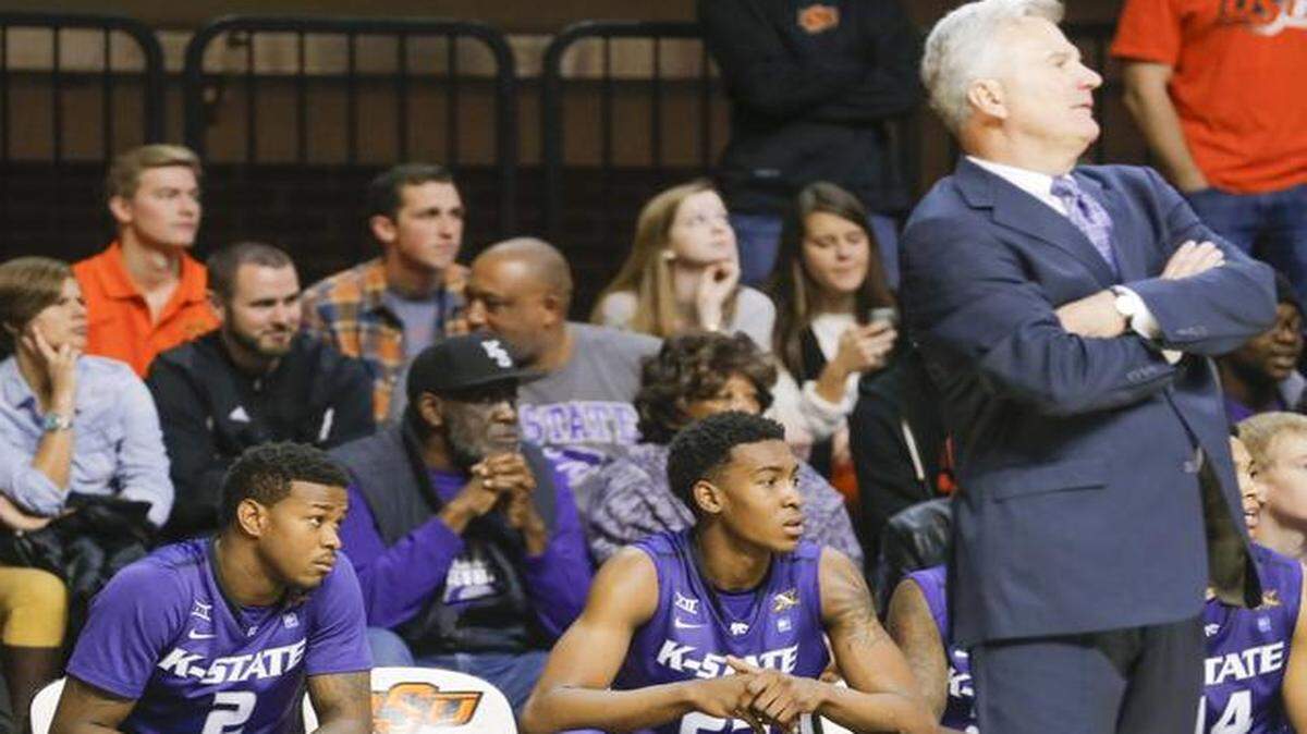 
Kansas State coach Bruce Weber watches the Wildcats lose at Oklahoma State with guard Marcus Foster, left, spending most of the game on the bench.
