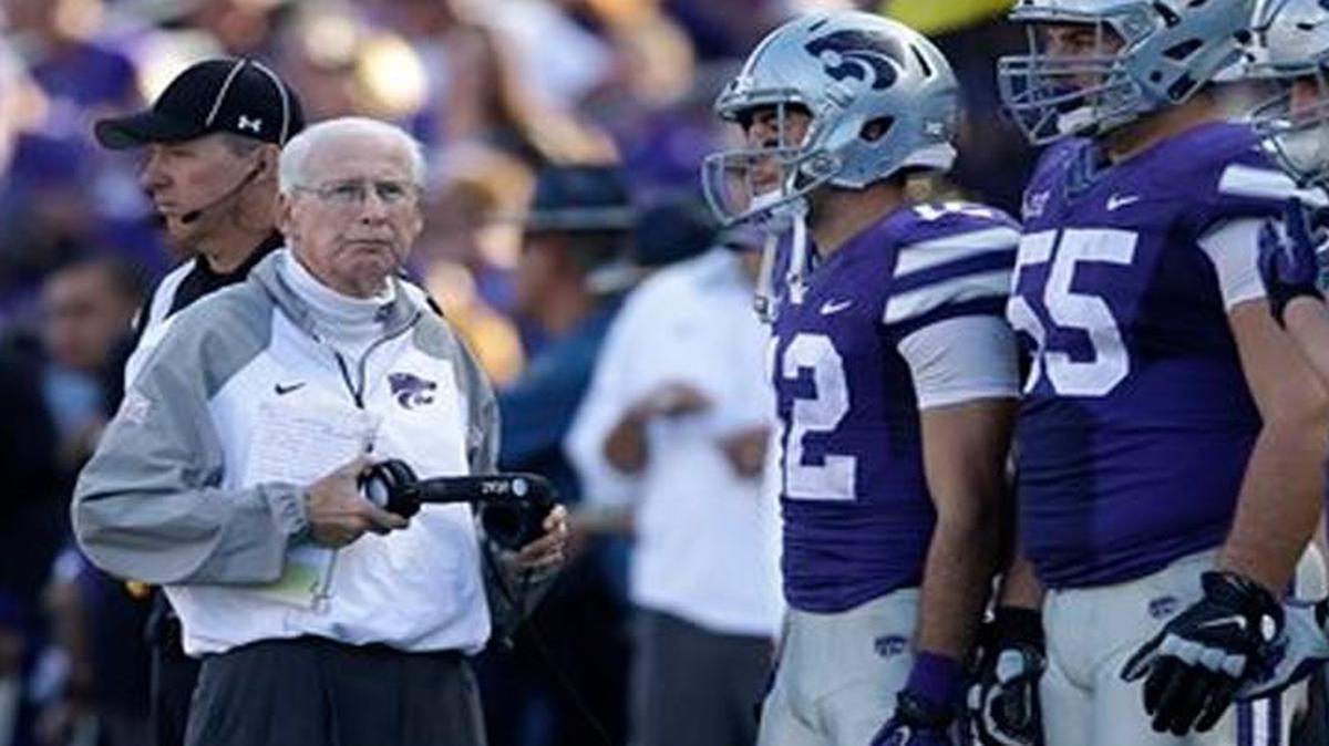 
Kansas State head coach Bill Snyder (left) stood with the team captains before an overtime coin toss in Saturday’s game against Louisiana Tech in Manhattan, Kan. Kansas State defeated Louisiana Tech 39-33 in triple overtime.
