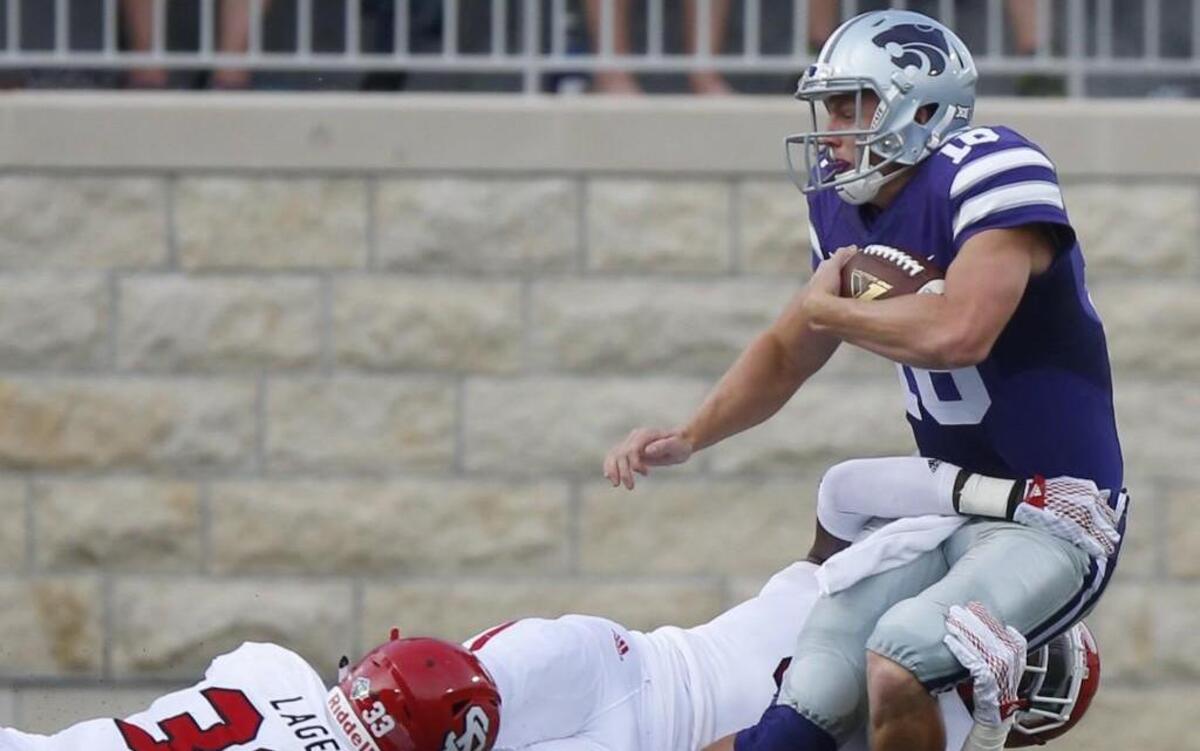 Kansas State quarterback Jesse Ertz (right) suffered a torn ACL in his right knee on this play on Sept. 5 in a game against South Dakota Coyotes. He was out the rest of the season but has recovered.