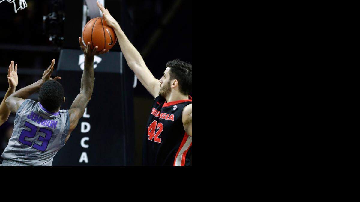 
Georgia forward Nemanja Djurisic (right) blocked a shot by Kansas State guard Nigel Johnson during the first half Wednesday
