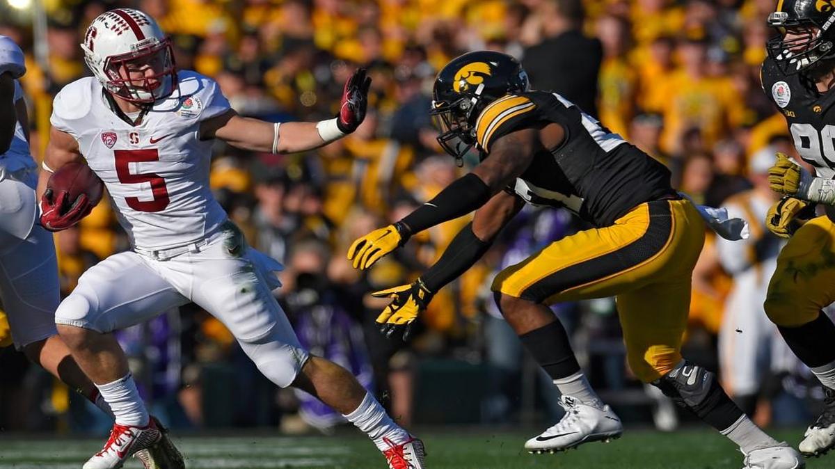 Last year, running back Christian McCaffrey (left) helped Stanford crush Iowa in the Rose Bowl.