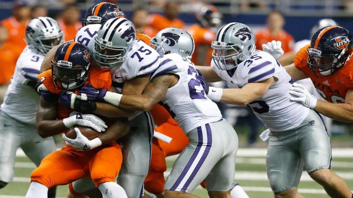 
K-State defenders put the stop on UTSA roadrunners running back Jarveon Williams last Saturday.

