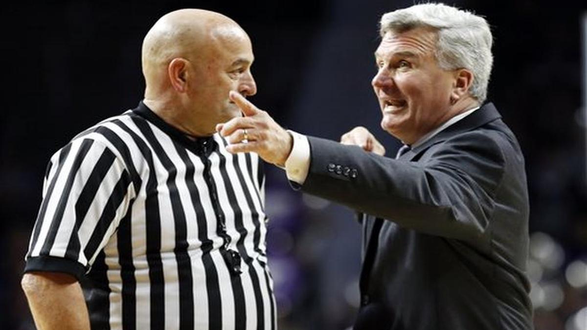 Kansas State head coach Bruce Weber talks with one of the officials during a timeout in the second half of an NCAA college basketball game against South Carolina State in Manhattan, Kan.