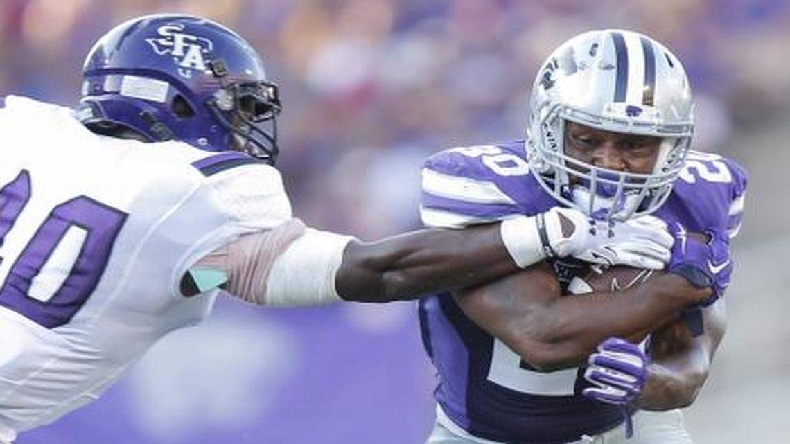 
Kansas State’s DeMarcus Robinson avoided Stephen F. Austin’s Collin Garrett during last Saturday’s game.
