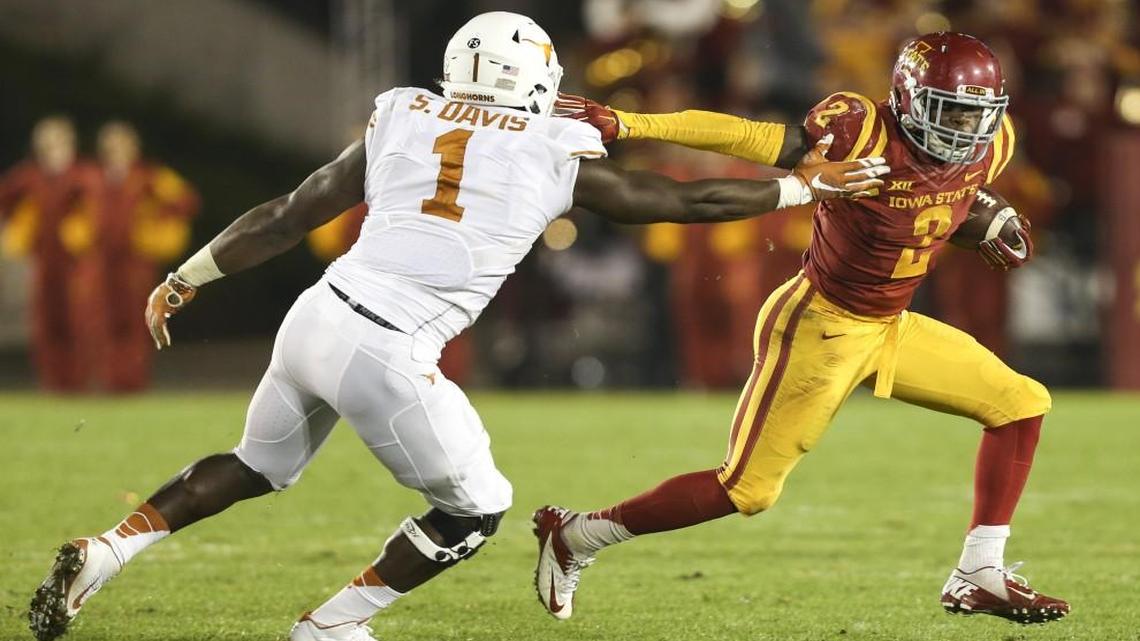 Iowa State running back Mike Warren tried to get around Texas defensive end Shiro Davis during a game in October.
