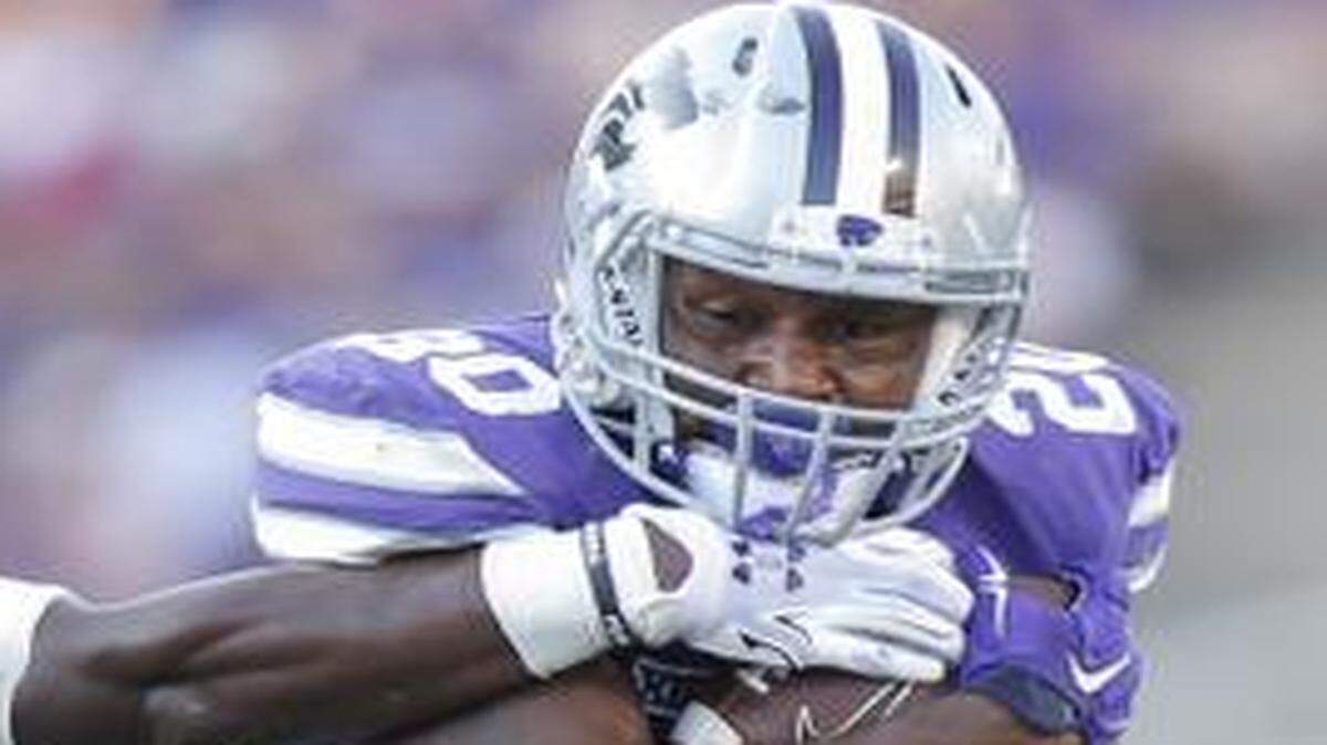 
Kansas State's DeMarcus Robinson, right, ran 11 times for 47 yards against Stephen F. Austin.

