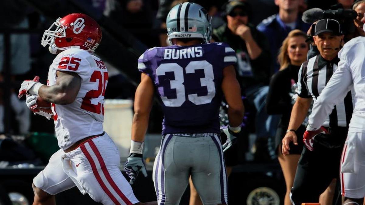 K-State defensive back Morgan Burns watches as Oklahoma running back Joe Mixon scores a touchdown in Manhattan. (AP Photo/Nati Harnik)