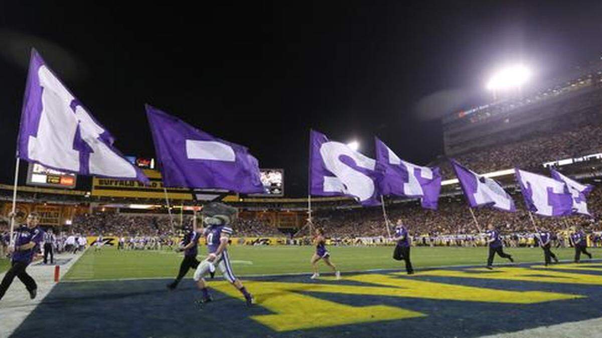 
K-State’s cheer squad celebrates after a K-State touchdown at the Buffalo Wild Wings Bowl last December.
