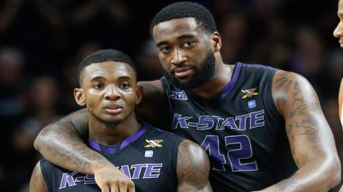 
K-State forward Thomas Gipson hugs guard Jevon Thomas after Thomas drew a foul in the closing seconds of the first half against Texas. (February 7, 2015)

