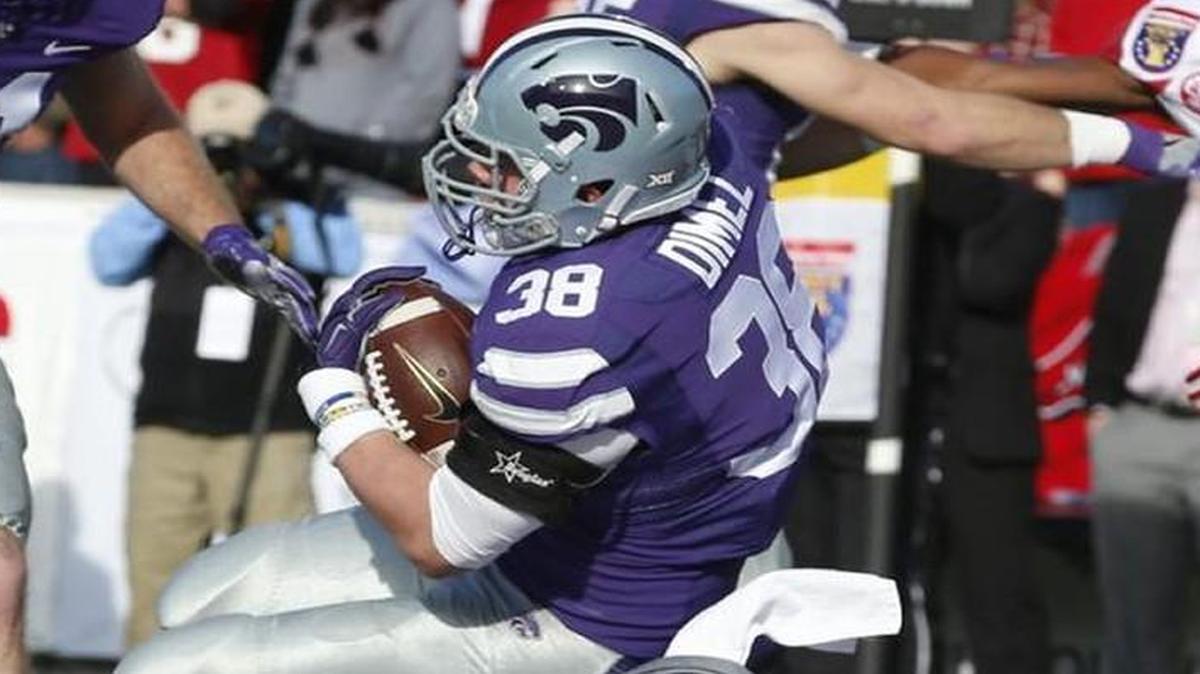 K-State fullback Winston Dimel powered into the end zone for a touchdown in the first quarter Saturday against Arkansas.