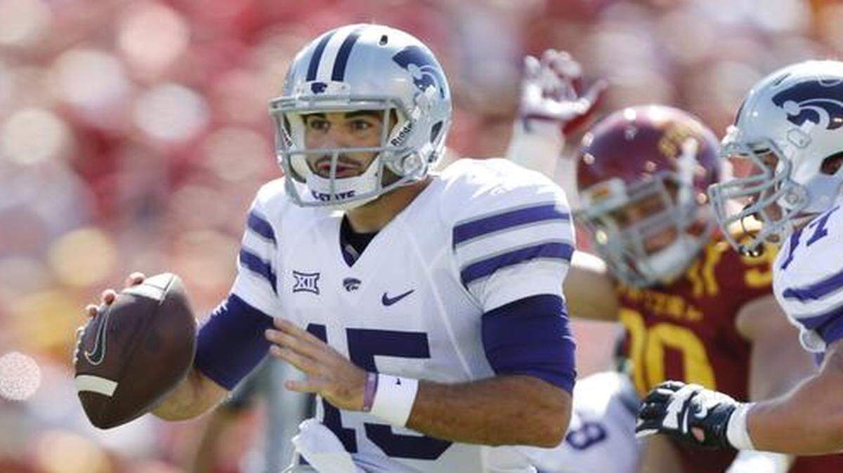 
Kansas State quarterback Jake Waters scrambled away from the Iowa State defense as he looked for an open receiver during the first half on Sept. 6 in Ames, Iowa.
