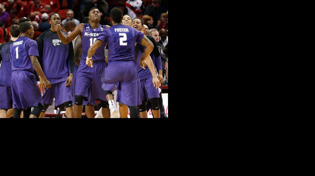 
Kansas State players celebrated Saturday after upsetting No. 16 Oklahoma 66-63 in overtime in Norman, Okla.


