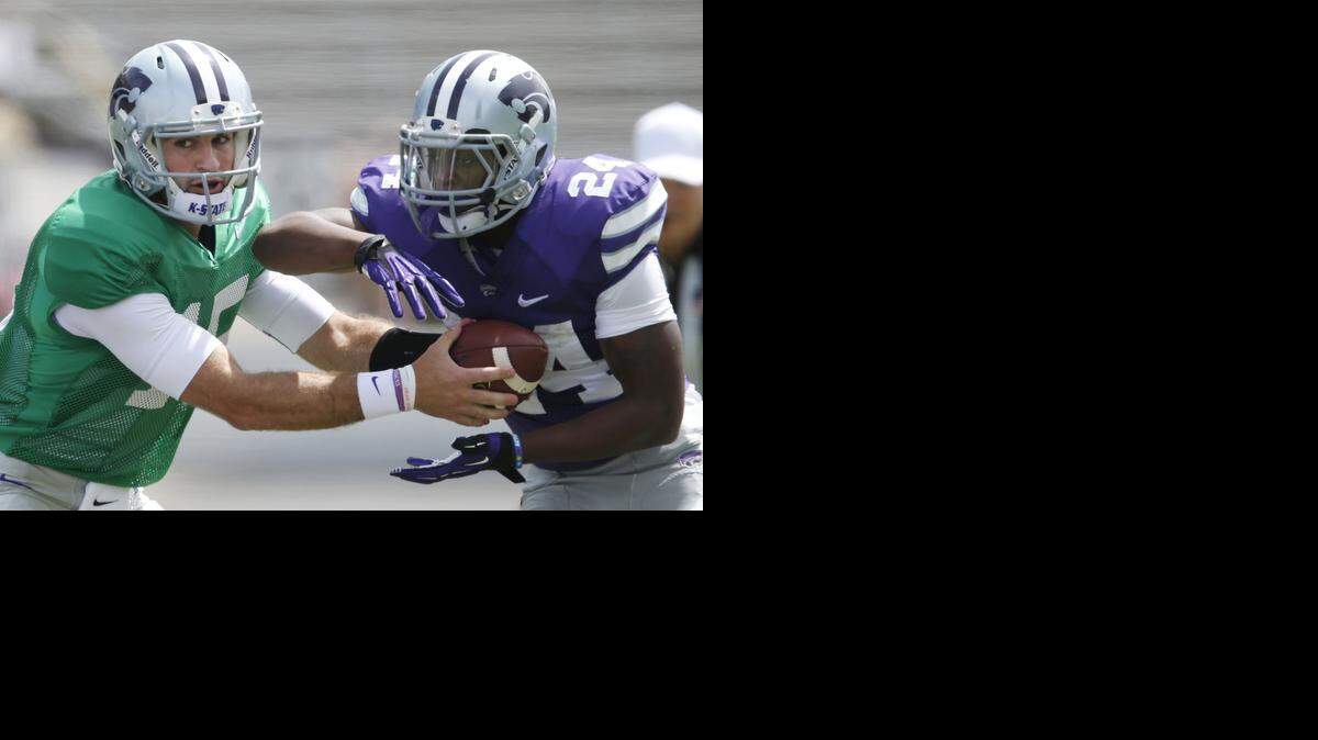 Charles Jones (right), a sophomore without college game experience, was considered one of the potential starters at running back for K-State. <252><252><252> <137>scrimmage in Manhattan, Kan., on Saturday, April 26, 2014. (Bo Rader/Wichita Eagle/MCT)<137>