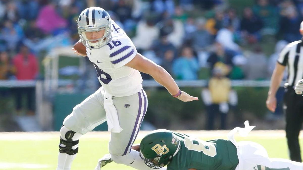 K-State quarterback Jesse Ertz sprints for long yardage Saturday afternoon. Ertz lead K-State in rushing in the first half. (November 19, 2016)