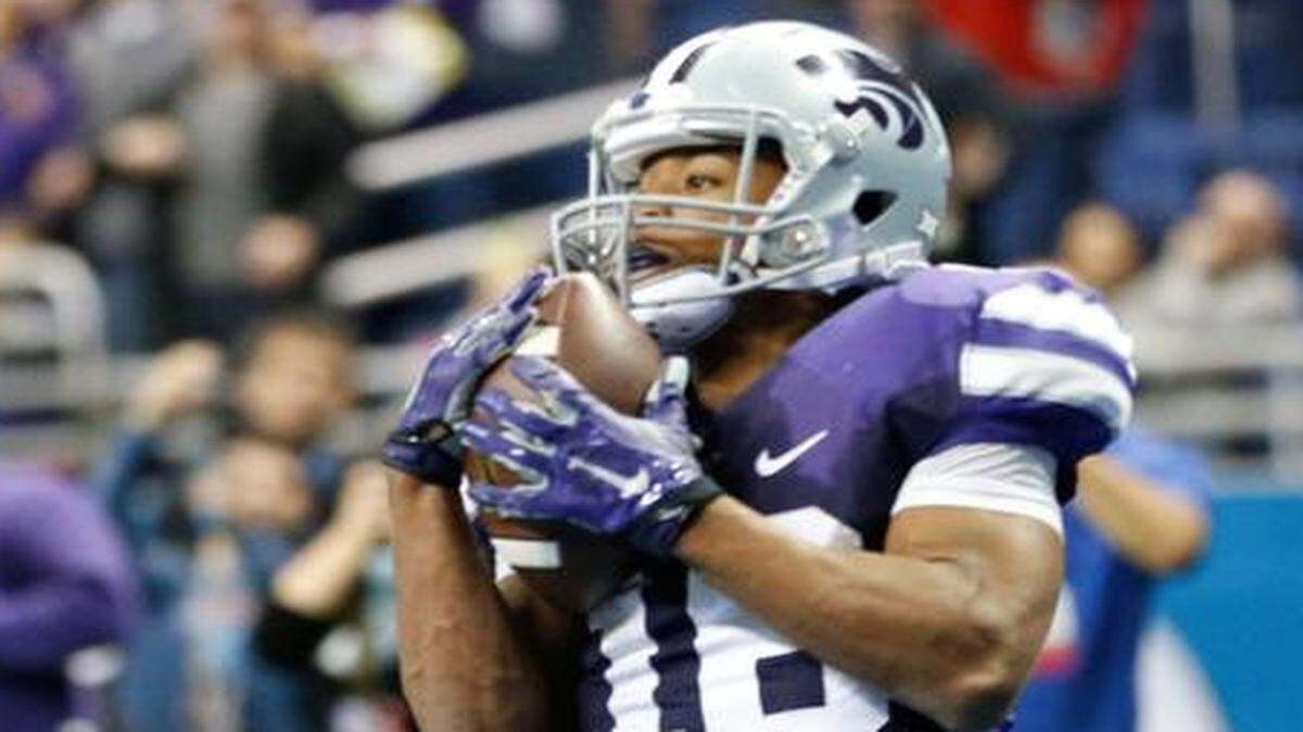 
K-State receiver Tyler Lockett grabs a touchdown pass late in the fourth quarter to put the Wildcats within five points of UCLA.
