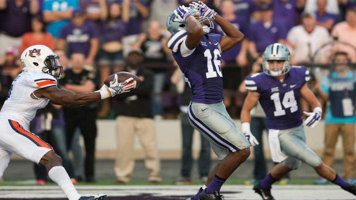 
Auburn defensive back Jonathan Jones (3) grabs the ball for an interception as Kansas State wide receiver Tyler Lockett (16) reacts to missing a catch in the end zone during the first quarter of Thursday’s game at Bill Snyder Family Stadium in Manhattan.
