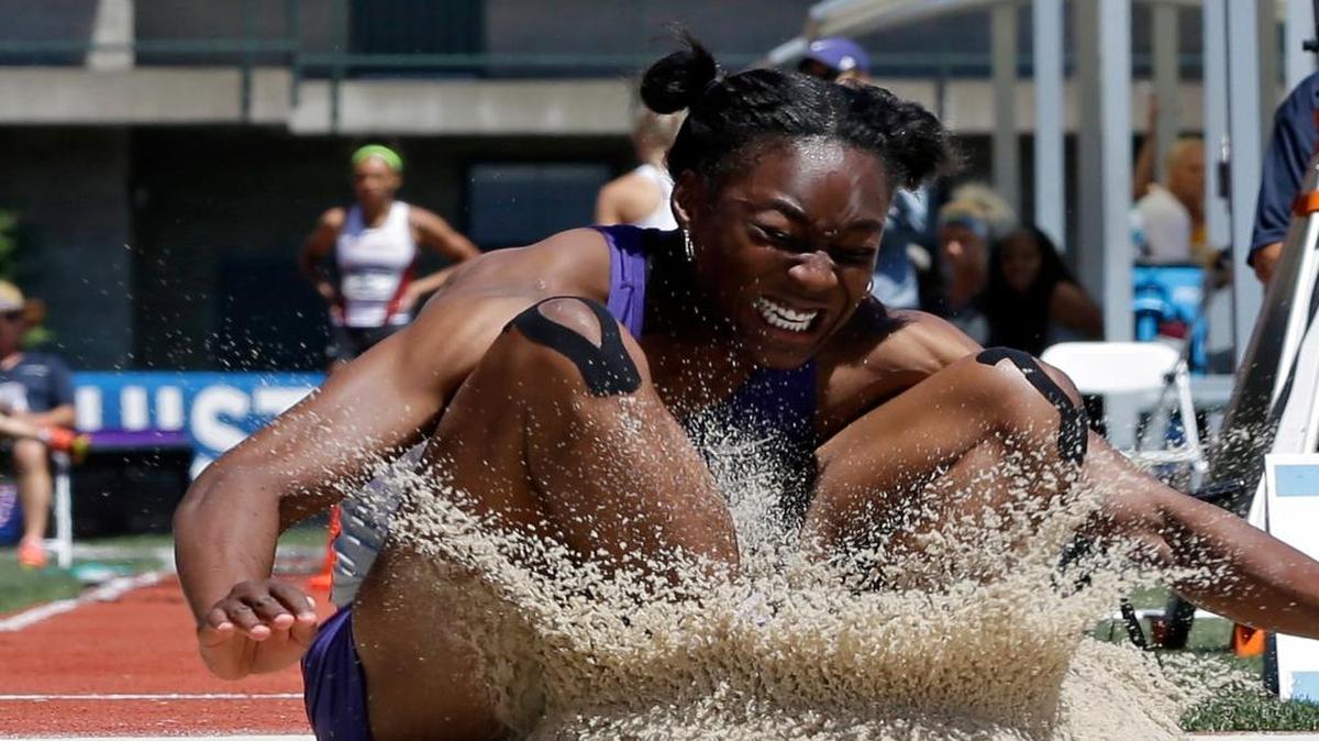 
Kansas State's Akela Jones landed in the sand pit during the long jump event of the heptathlon competition at the NCAA track and field championships on Thursday in Eugene, Ore.
