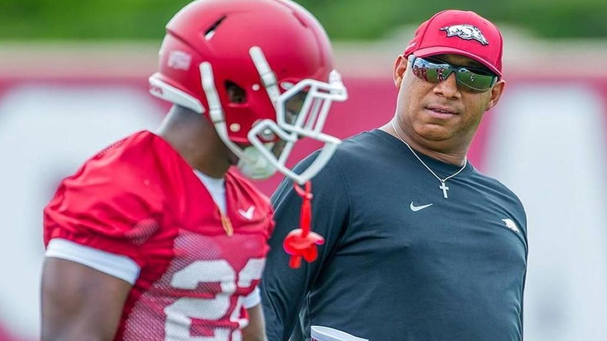 Arkansas receivers coach Michael Smith, right, is in his fourth year on the Razorbacks’ staff after being a part of the K-State program since 1988.