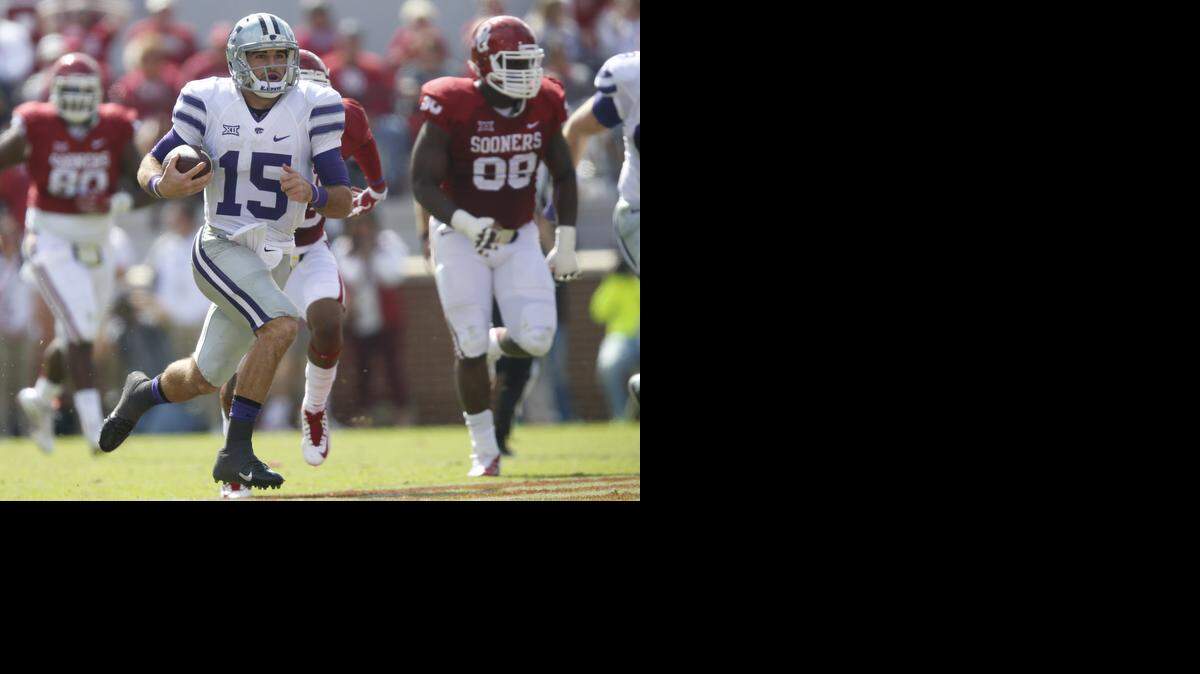 
K-State quarterback Jake Waters (15) breaks free for a huge run against Oklahoma Saturday early in the 2nd half setting up a touchdown shortly after. (October 18, 2014)
