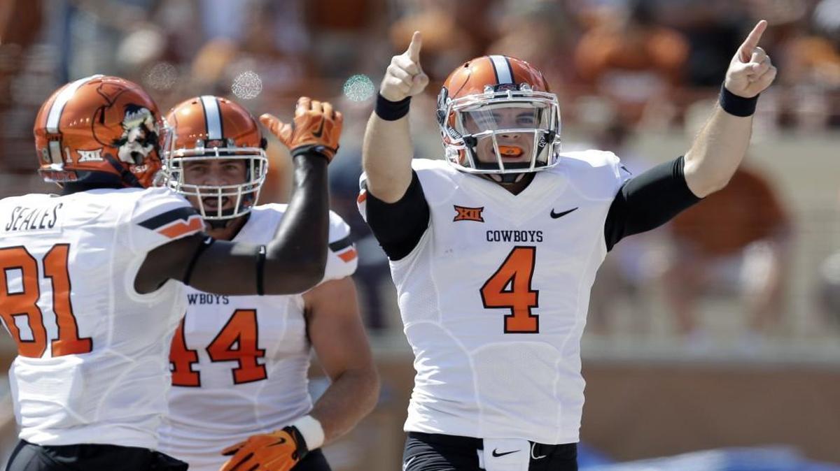 
Oklahoma State’s J.W. Walsh celebrates a touchdown against Texas during last Saturday’s game.
