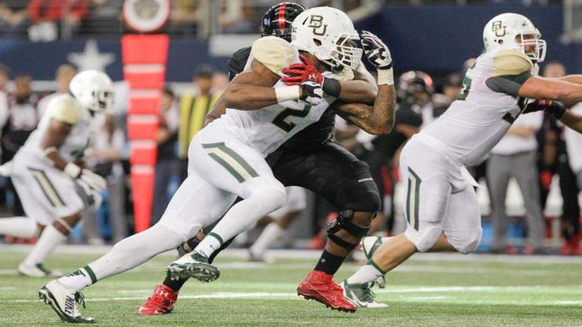 
Baylor defensive end Shawn Oakman (2) in action in the first half of an NCAA college football game against Texas Tech. (AP Photo/Tim Sharp)
