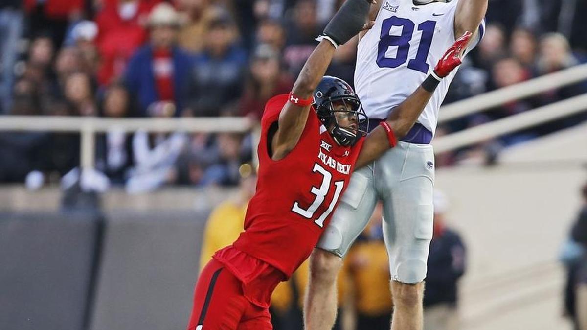 Kansas State wide receiver Kyle Klein attempted a catch over Texas Tech defensive back Justis Nelson during Saturday’s game.