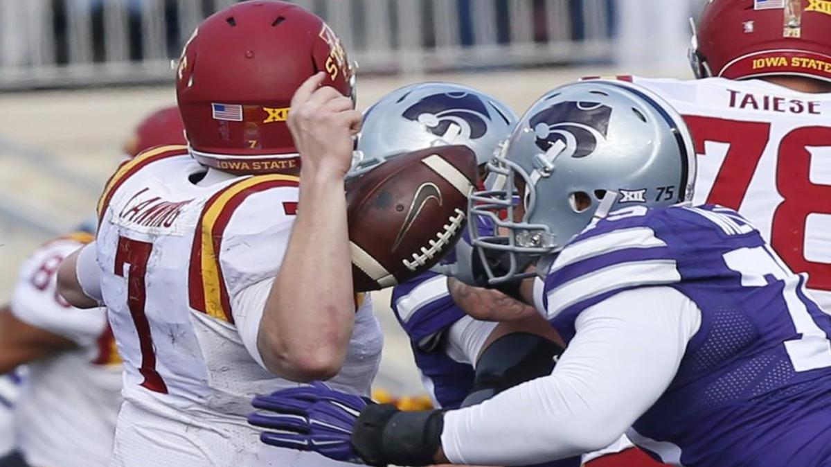 Kansas State defensive end Jordan Willis knocked the ball away from Iowa State quarterback Joel Lanning during the Wildcats’ 38-35 win Saturday.