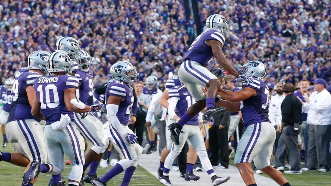 K-State defensive back DJ Reed celebrates an interception with teammates.(October 8, 2016)