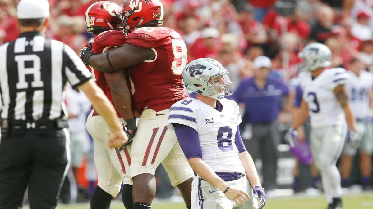 K-State quarterback Joe Hubener rests on this knees after getting sack Saturday afternoon in the 3rd quarter against Oklahoma.(October 15, 2016)