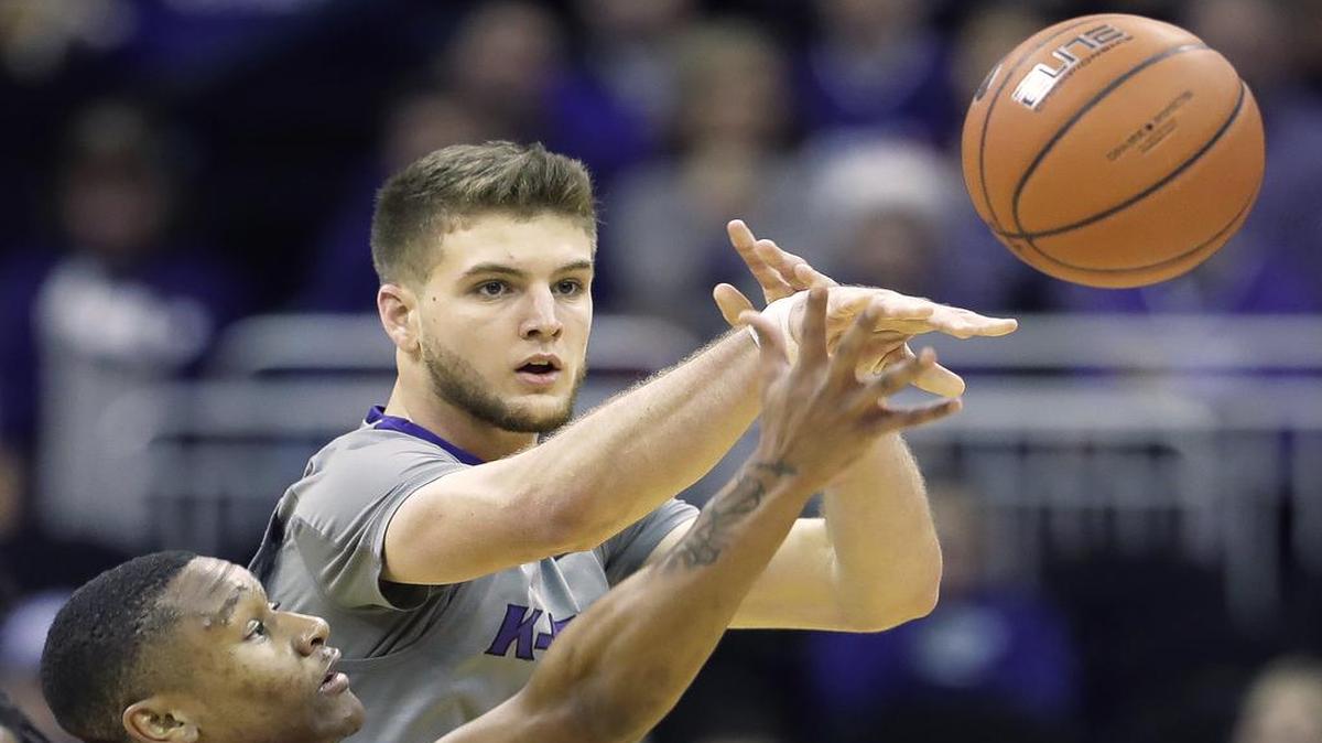 Dean Wade (right) is part of a rare size advantage for Kansas State against Kansas. The Sunflower State rivals meet Tuesday night in Lawrence.
