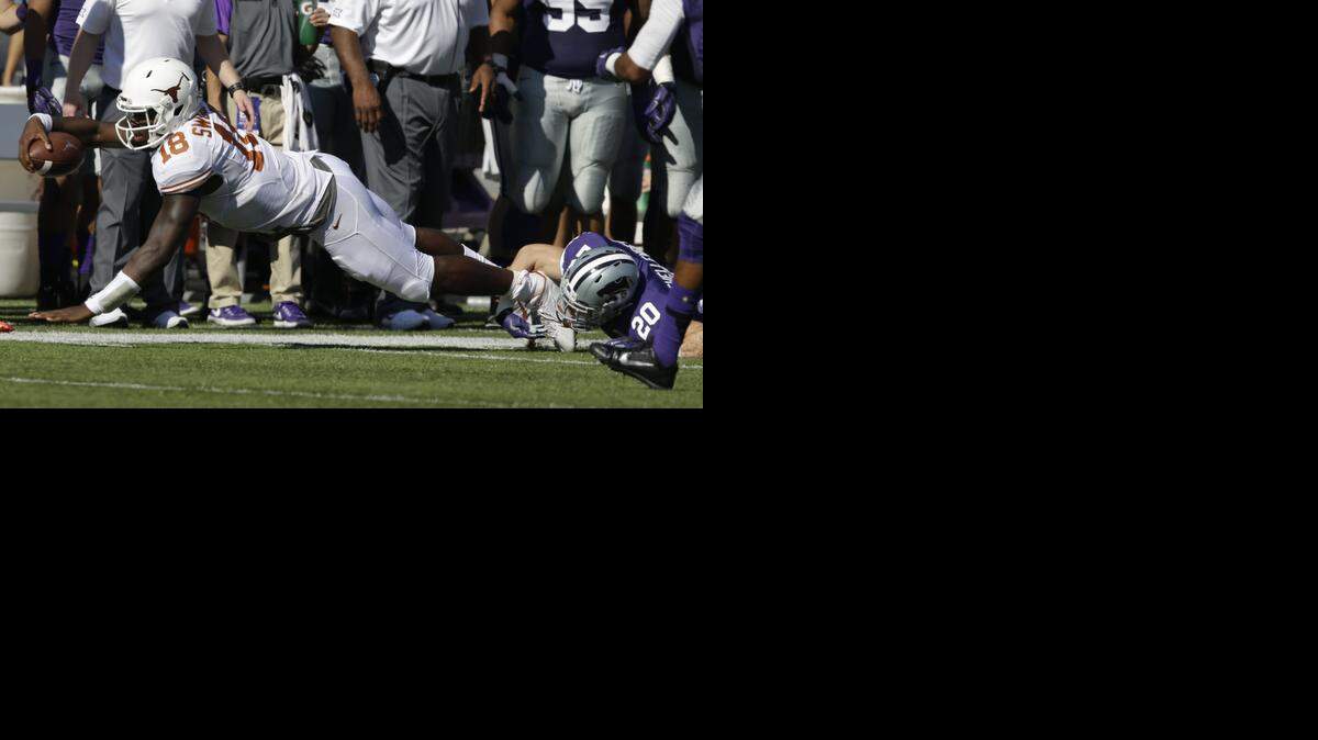 
Texas quarterback Tyrone Swoopes was tackled by K-State defensive back Dylan Schellenberg on Saturday in Manhattan, Kan.
