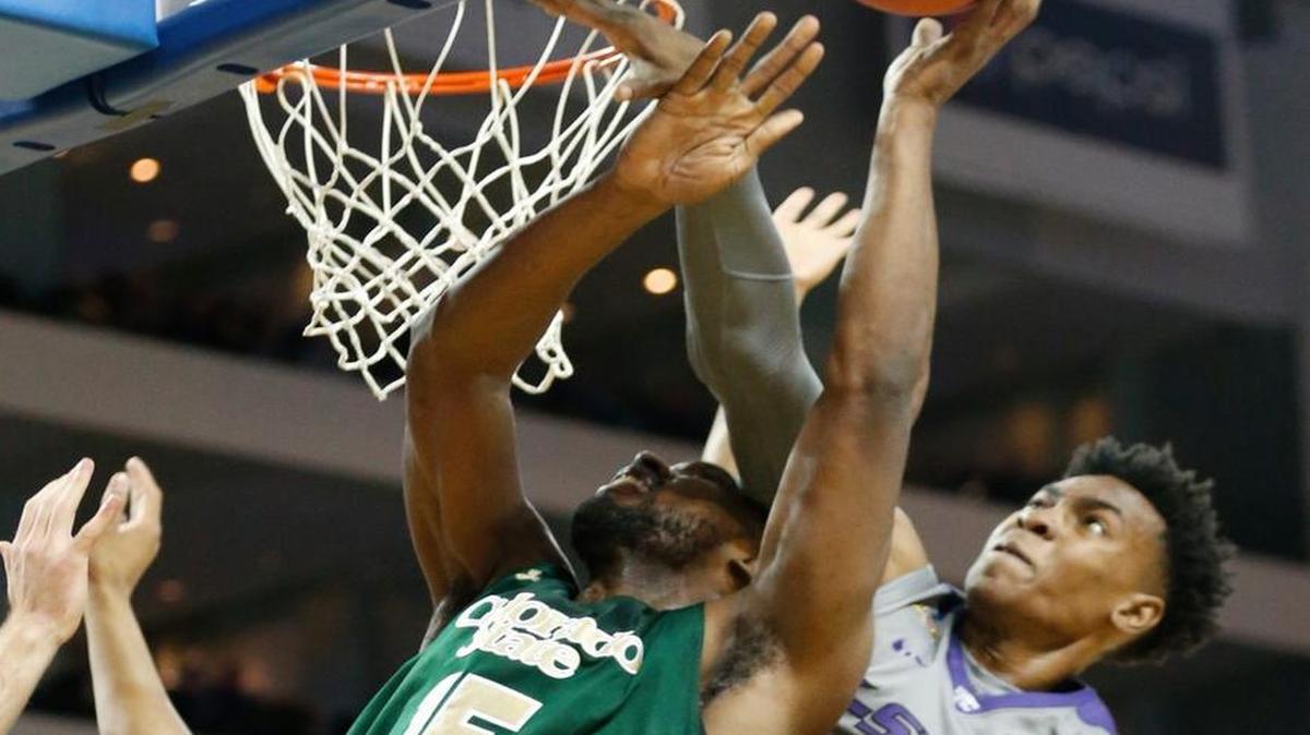 Colorado State forward Tiel Daniels (15) and Kansas State forward Wesley Iwundu (25) battled for a rebound in the first half Saturday as the Rams and Wildcats played at Intrust Bank Arena in Wichita.
