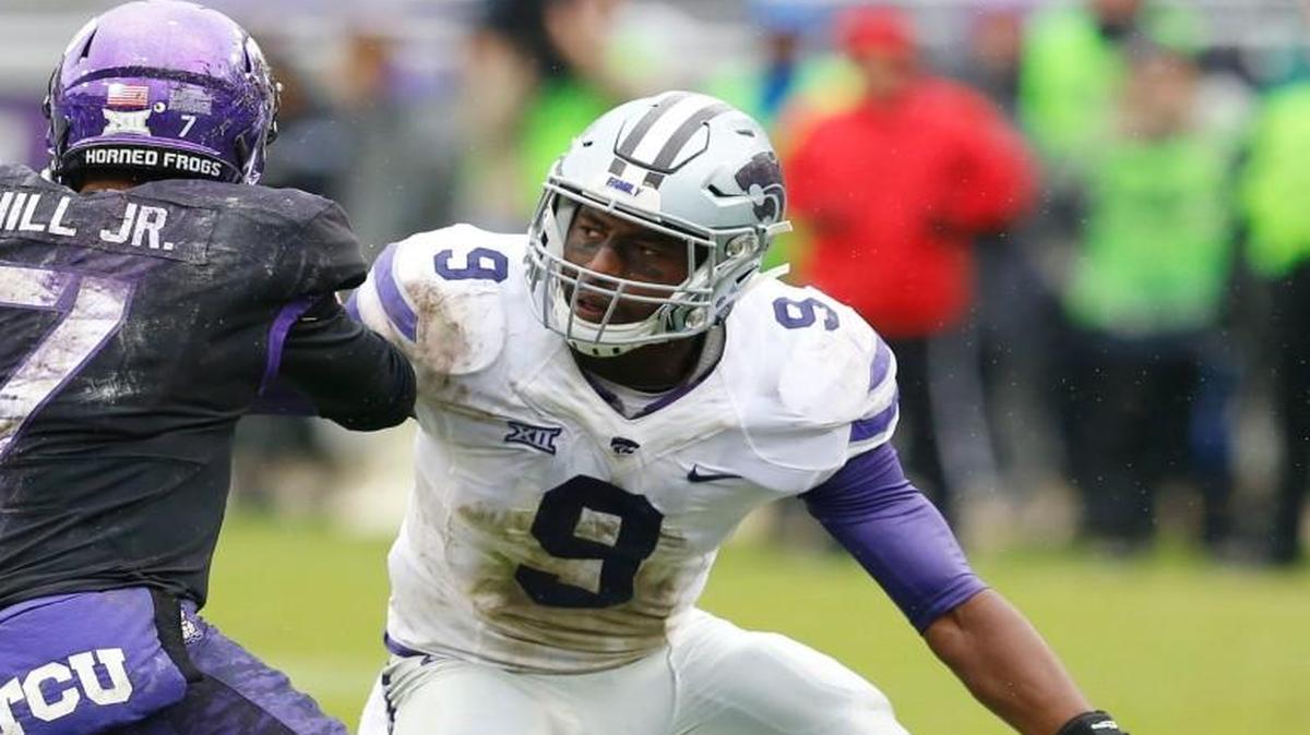 K-State linebacker Elijah Lee sizes up TCU quarterback Kenny Hill before making the tackle. (December 3, 2016)