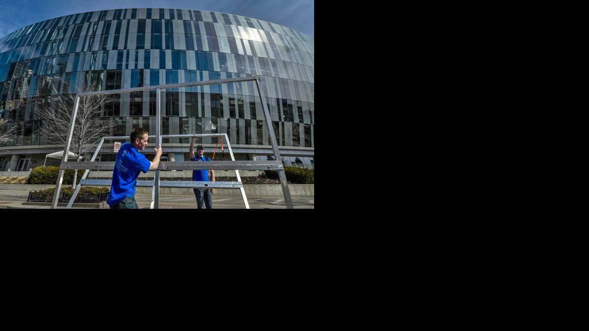 
Members of the University of Kansas Army and Air Force ROTC, including Drew Erickson (left) and Michael Thomas, prepare the framework for the fast pitch tent on Monday, March 9, 2015, outside the Sprint Center for the upcoming Big 12 Men's Basketball Championship at Sprint Center in Kansas City. The first round games will be played on Wednesday, March 11, 2015, and the championship final will be played on Saturday, March 14, 2015.
