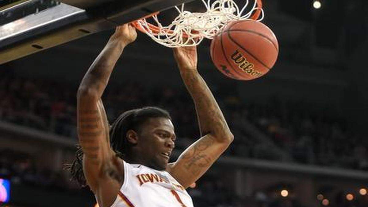 
Iowa State forward Jameel McKay (1) dunked over Oklahoma forward TaShawn Thomas (35) in first half game action Friday at the Big 12 Tournament at Sprint Center.
