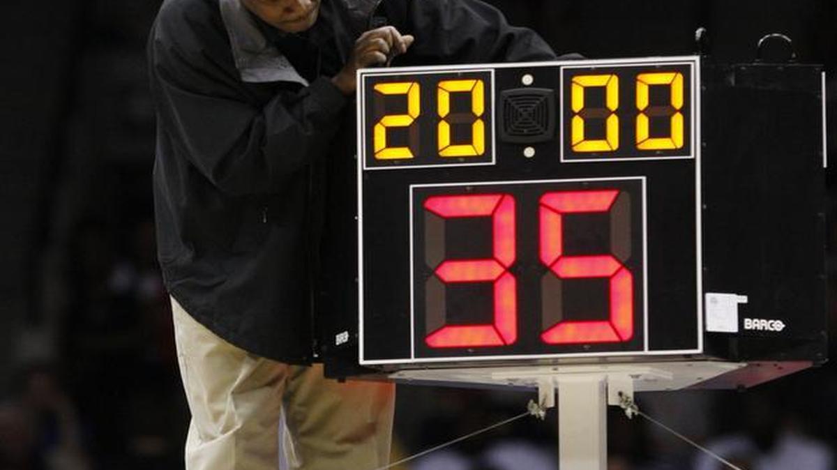 
In this March 19, 2010 file photo, a technician adjusted a shot clock after it malfunctioned and delayed the start of California’s game against Louisville.
