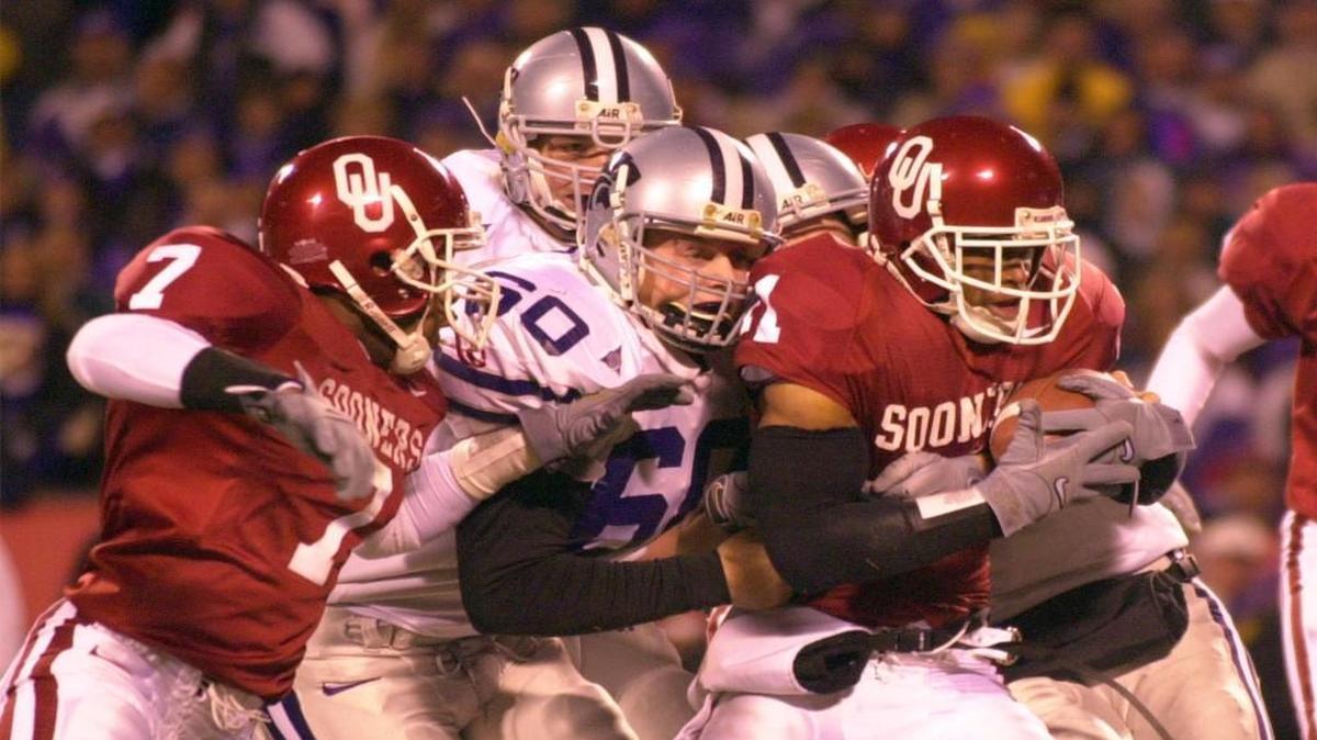 Oklahoma defensive back Ontei Jones is tackled by Kansas State’s Neil Gosch after picking up a blocked punt during the second quarter of the Big 12 championship game in 2000 at Arrowhead Stadium. The conference used six-team North and South divisions then.