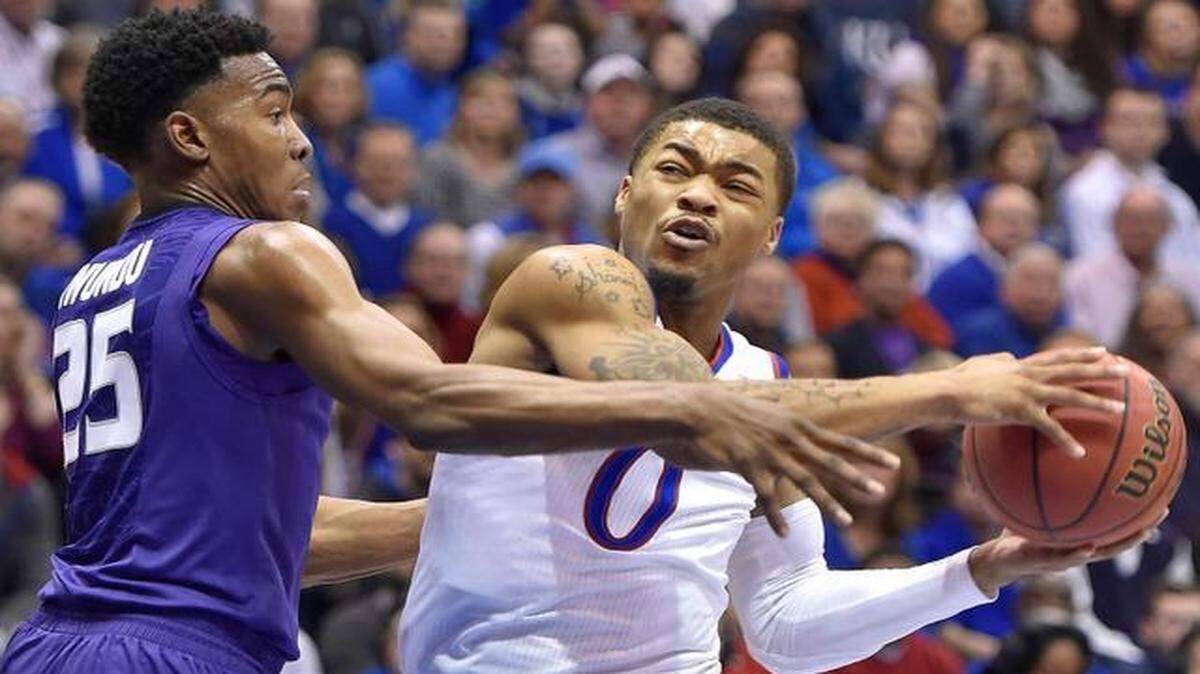 
KU's Frank Mason (right) drives on KSU's Wesley Iwundu during the first half of Saturday's game at Allen Fieldhouse in Lawrence, Kan.
