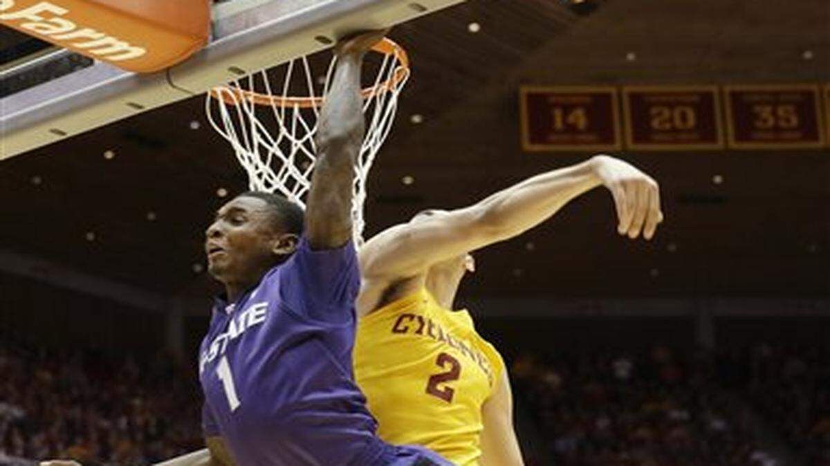 
Kansas State guard Jevon Thomas (1) has his shot blocked by Iowa State forward Abdel Nader (2) during the second half of an NCAA college basketball game, Tuesday, Jan. 20, 2015, in Ames, Iowa. Iowa State won 77-71. (AP Photo/Charlie Neibergall)
