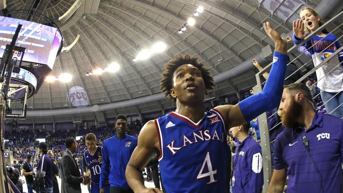 Kansas guard Devonte' Graham exited the court in triumph after scoring 28 points in an 88-84 win over TCU on Saturday in Fort Worth, Texas.
