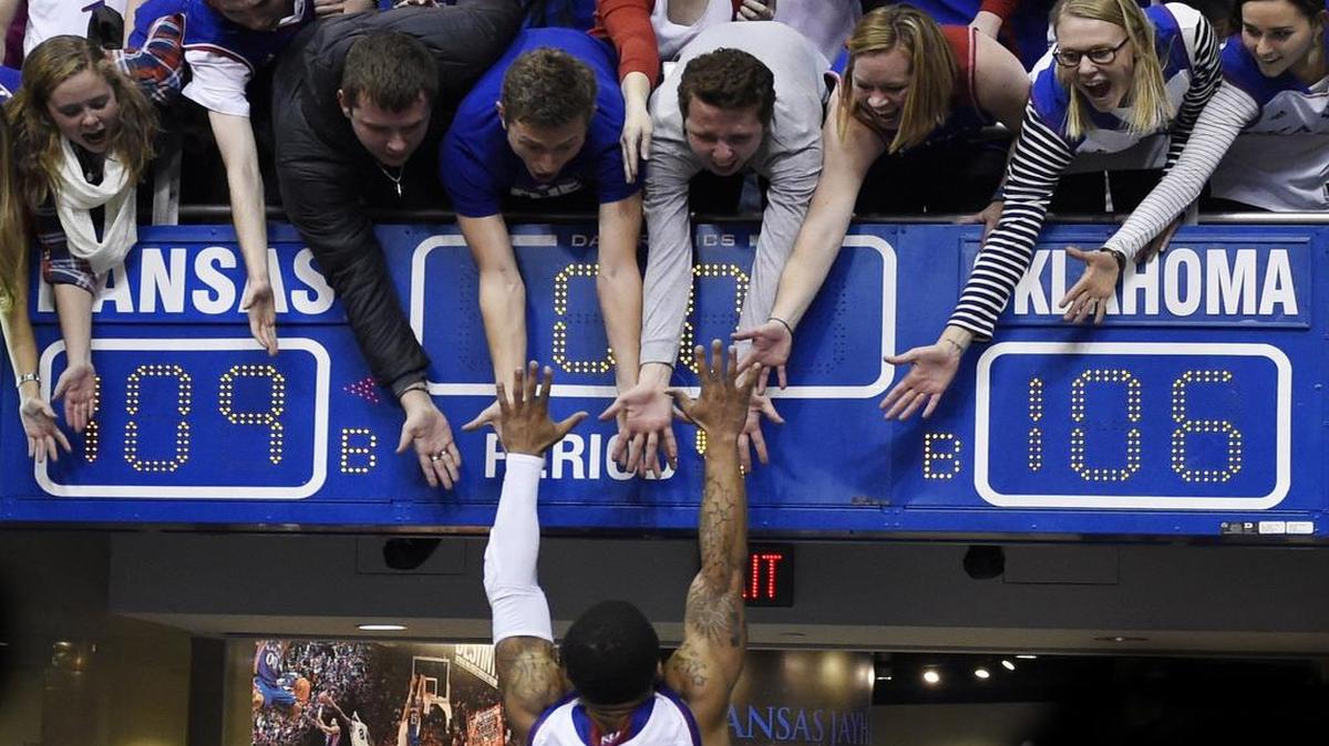 KU’s Frank Mason jumped into the arms of fans after the Jayhawks beat Oklahoma 109-106 in triple overtime last season at Allen Fieldhouse.