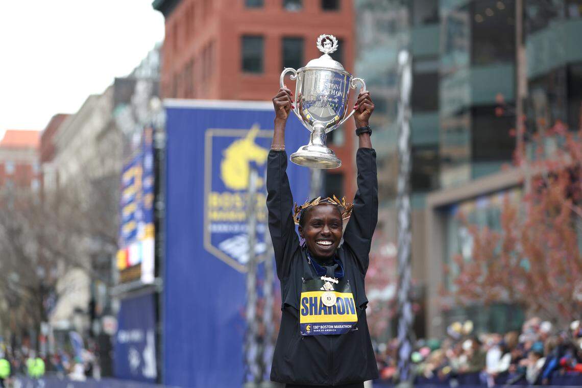 Sharon Lokedi of Kenya poses with the trophy after winning the women's Boston Marathon on April 20, 2026 in Boston, Massachusetts. Lokedi successfully defended her 2025 win.